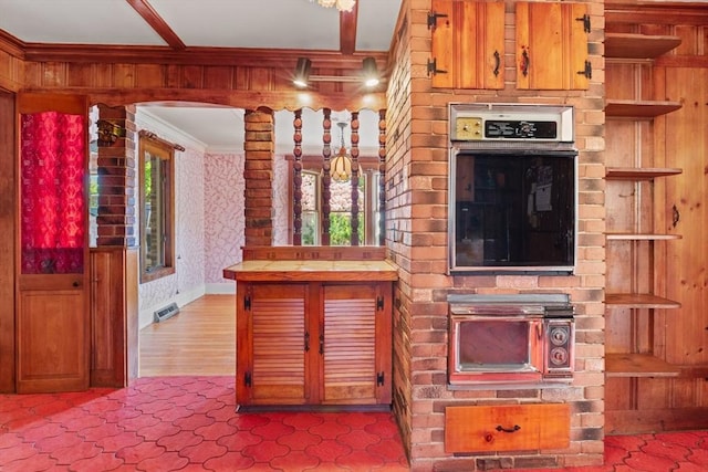 676 Salem St, Groveland, MA 01834 - kitchen featuring oven, ornamental molding, tile countertops, wallpapered walls, and arched walkways