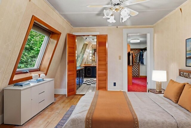 676 Salem St, Groveland, MA 01834 - bedroom with light wood finished floors, a walk in closet, ornamental molding, a closet, and ensuite bathroom