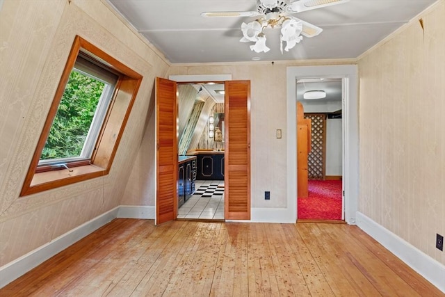 676 Salem St, Groveland, MA 01834 - unfurnished room featuring hardwood / wood-style flooring, baseboards, a ceiling fan, and ornamental molding
