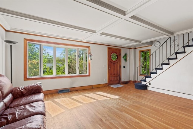 676 Salem St, Groveland, MA 01834 - living area with baseboards, wood finished floors, healthy amount of natural light, coffered ceiling, and beam ceiling