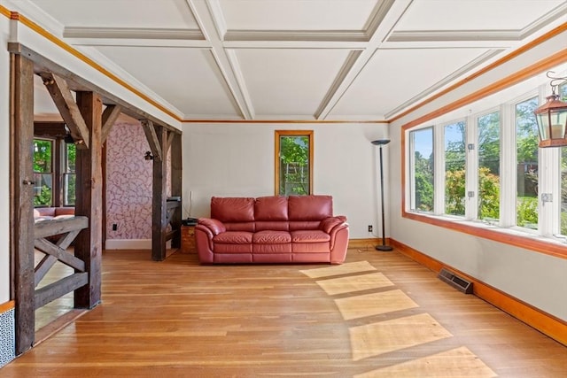 676 Salem St, Groveland, MA 01834 - living area featuring coffered ceiling, baseboards, light wood-style flooring, and ornamental molding