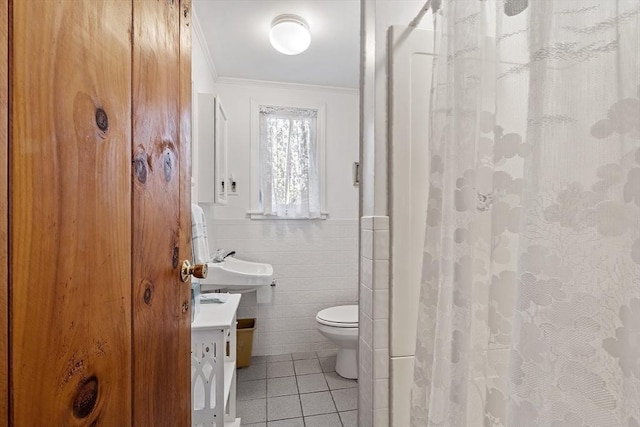 full bathroom with tile patterned flooring, crown molding, toilet, tile walls, and a shower with shower curtain