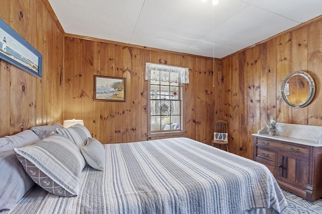 bedroom featuring wood walls