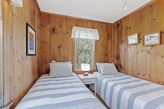 bedroom featuring wood walls