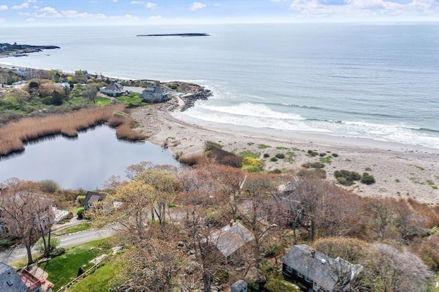 aerial view of property and surrounding area with expansive beach