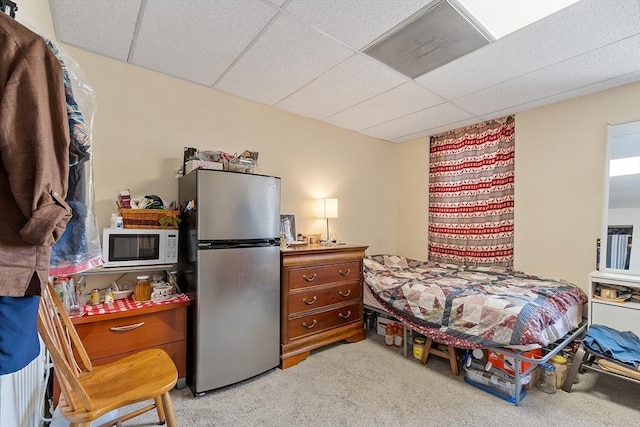 104 Pleasant St, Worcester, MA 01609 - bedroom with freestanding refrigerator, a drop ceiling, and light colored carpet