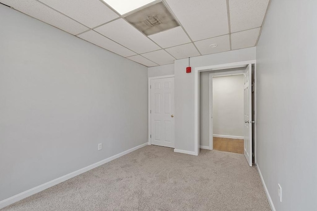 104 Pleasant St, Worcester, MA 01609 - unfurnished bedroom featuring a paneled ceiling and carpet floors