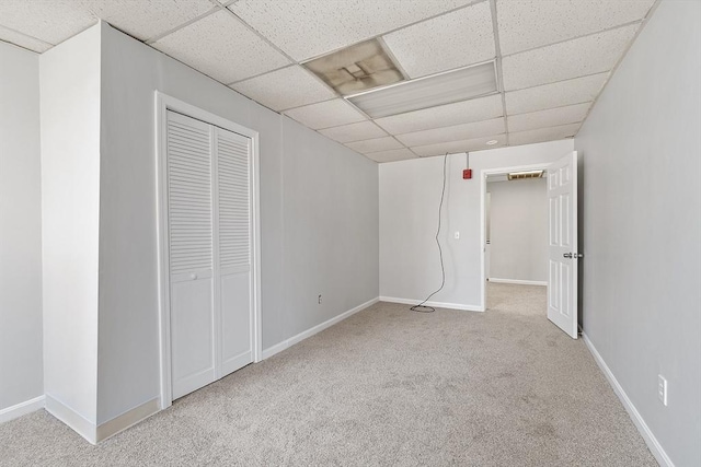 104 Pleasant St, Worcester, MA 01609 - unfurnished bedroom featuring a paneled ceiling, carpet floors, and a closet