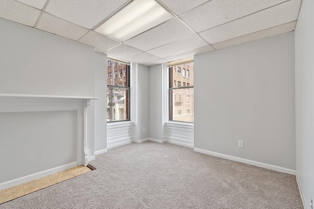 104 Pleasant St, Worcester, MA 01609 - unfurnished living room with carpet and a drop ceiling