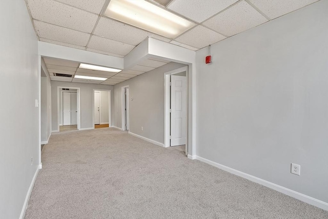 104 Pleasant St, Worcester, MA 01609 - carpeted empty room with a drop ceiling and baseboards