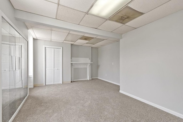 104 Pleasant St, Worcester, MA 01609 - unfurnished bedroom featuring carpet floors and a paneled ceiling