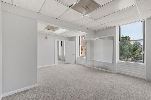 104 Pleasant St, Worcester, MA 01609 - carpeted spare room with a paneled ceiling and baseboards