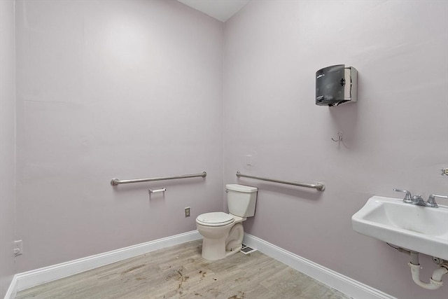104 Pleasant St, Worcester, MA 01609 - bathroom with wood finished floors and toilet