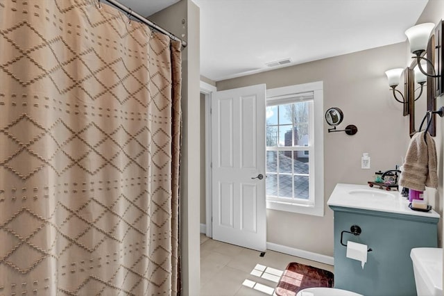 bathroom with a shower with shower curtain, visible vents, baseboards, tile patterned flooring, and vanity