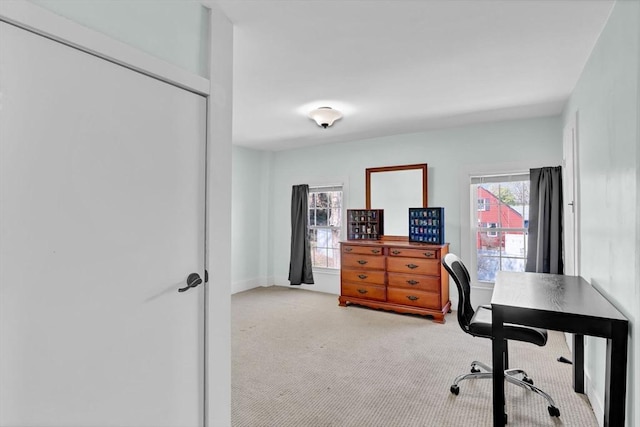 office area with light colored carpet
