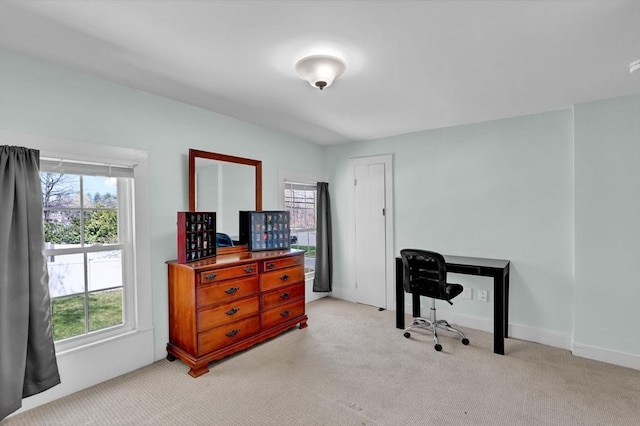 office featuring light colored carpet and baseboards