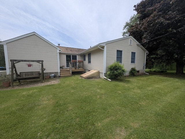 74 Ellis Rd, Southbridge, MA 01550 - back of property with a deck and a yard