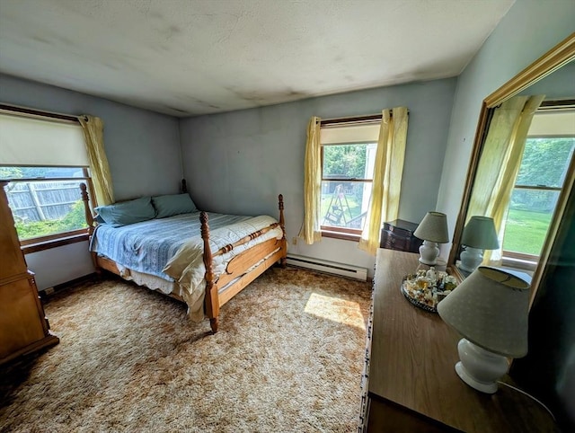 74 Ellis Rd, Southbridge, MA 01550 - bedroom with a baseboard heating unit and carpet