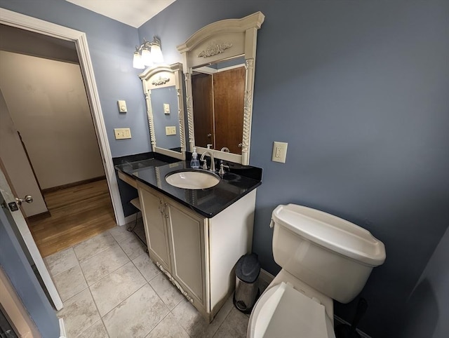 74 Ellis Rd, Southbridge, MA 01550 - bathroom with vanity, toilet, tile patterned floors, and baseboards