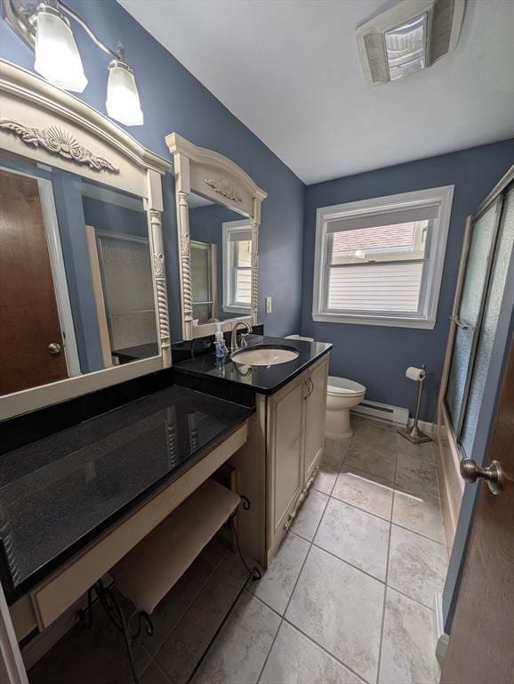 74 Ellis Rd, Southbridge, MA 01550 - bathroom featuring vanity, toilet, a baseboard heating unit, baseboards, and tile patterned floors