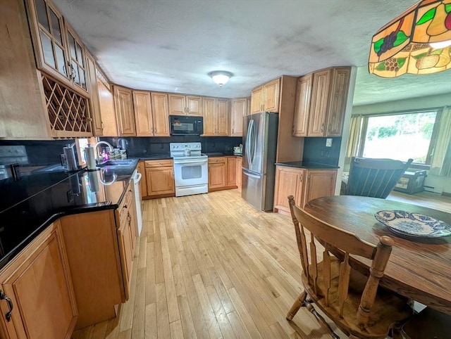 74 Ellis Rd, Southbridge, MA 01550 - kitchen featuring white electric stove, black microwave, freestanding refrigerator, and dark countertops