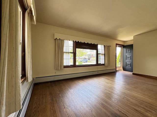4 Norman Cir, Montague, MA 01376 - spare room featuring a baseboard radiator, wood-type flooring, and baseboards