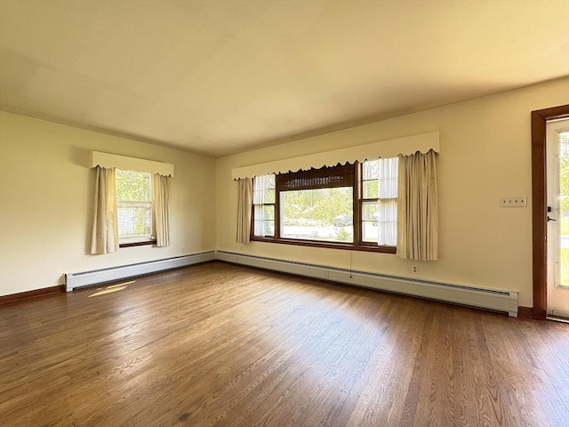 4 Norman Cir, Montague, MA 01376 - spare room with wood finished floors, baseboards, and a baseboard radiator