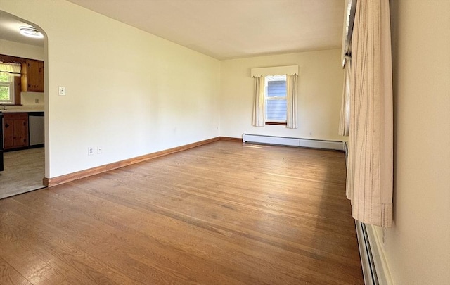 4 Norman Cir, Montague, MA 01376 - unfurnished room featuring a baseboard heating unit, wood finished floors, and baseboards