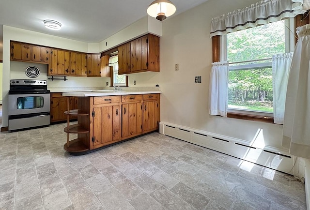 4 Norman Cir, Montague, MA 01376 - kitchen featuring stainless steel range with electric cooktop, brown cabinets, light countertops, baseboard heating, and open shelves