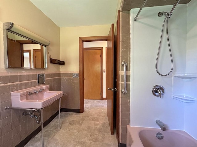 4 Norman Cir, Montague, MA 01376 - bathroom with tile walls, a sink, shower / tub combination, and wainscoting