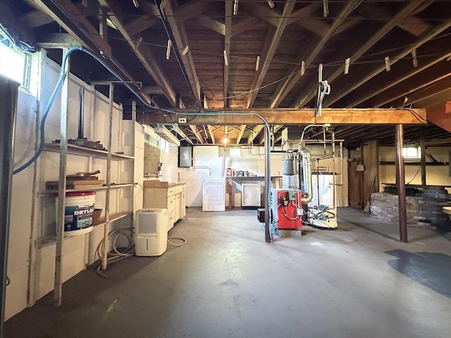 4 Norman Cir, Montague, MA 01376 - unfinished below grade area featuring electric panel, separate washer and dryer, a heating unit, and water heater
