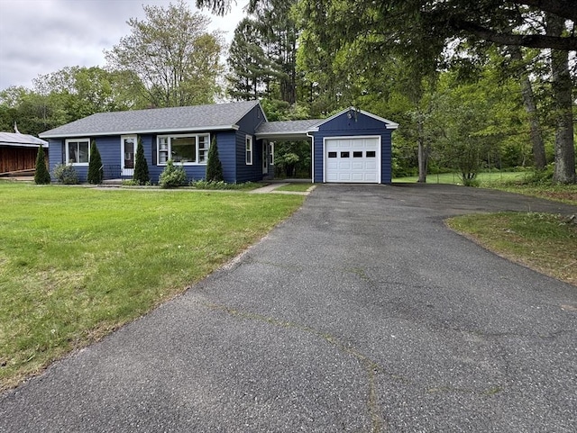 4 Norman Cir, Montague, MA 01376 - ranch-style house with a garage, asphalt driveway, a front yard, and a shingled roof