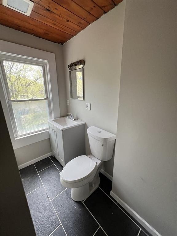 59 Carson Ave Unit 59, Clarksburg, MA 01247 - bathroom featuring wood ceiling, baseboards, toilet, and vanity