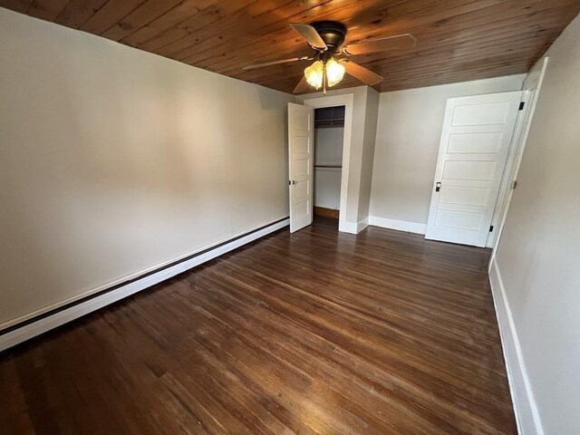 59 Carson Ave Unit 59, Clarksburg, MA 01247 - spare room with a baseboard heating unit, ceiling fan, wood ceiling, dark wood-type flooring, and baseboards