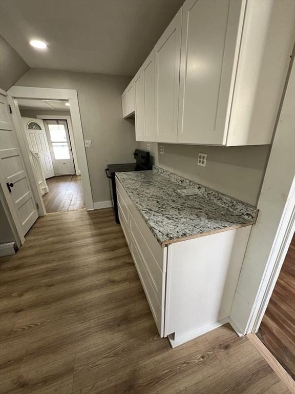 59 Carson Ave Unit 59, Clarksburg, MA 01247 - kitchen with white cabinets, black range with electric cooktop, dark wood-style floors, baseboards, and recessed lighting
