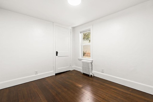 19 Arlington Rd, Dedham, MA 02026 - unfurnished room featuring radiator heating unit and dark wood-style floors