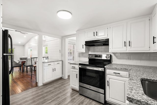 19 Arlington Rd, Dedham, MA 02026 - kitchen featuring electric range, under cabinet range hood, decorative backsplash, light wood-style flooring, and recessed lighting