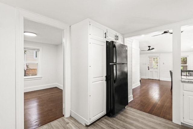19 Arlington Rd, Dedham, MA 02026 - kitchen with freestanding refrigerator, light wood-type flooring, white cabinets, and ceiling fan