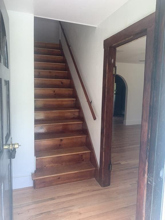 205 Gardner Rd, Hubbardston, MA 01452 - staircase with wood finished floors and arched walkways