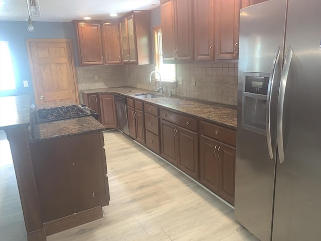 205 Gardner Rd, Hubbardston, MA 01452 - kitchen featuring stainless steel appliances, light wood-style flooring, and decorative backsplash