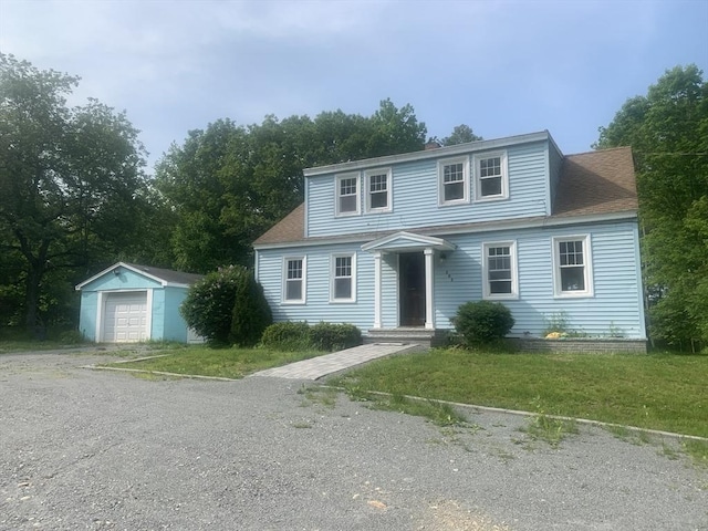 205 Gardner Rd, Hubbardston, MA 01452 - view of front of house featuring an outbuilding, gravel driveway, a garage, and a shingled roof