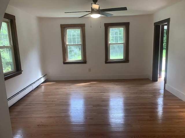205 Gardner Rd, Hubbardston, MA 01452 - spare room featuring baseboard heating, wood finished floors, and a ceiling fan