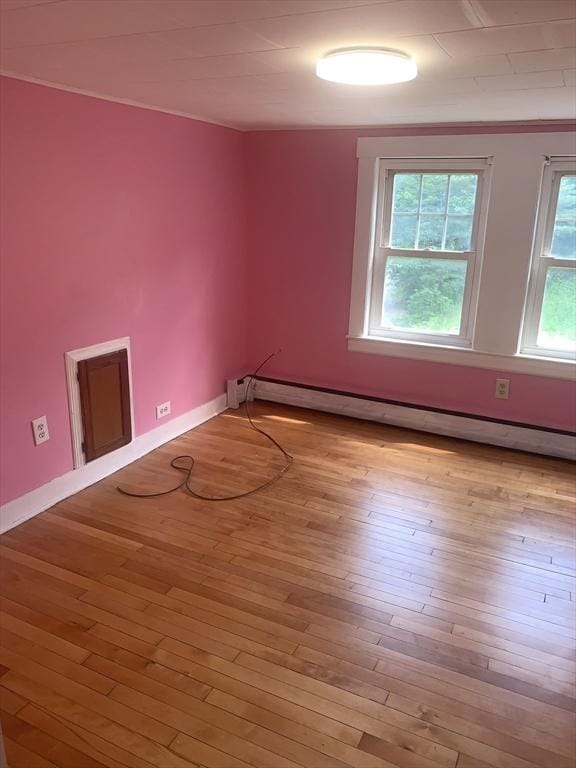 205 Gardner Rd, Hubbardston, MA 01452 - unfurnished room with a baseboard radiator, light wood-style flooring, and ornamental molding