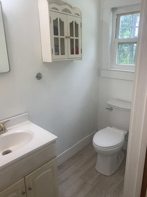 205 Gardner Rd, Hubbardston, MA 01452 - half bathroom with vanity and wood finished floors