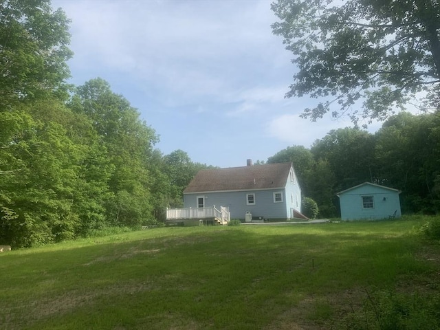 205 Gardner Rd, Hubbardston, MA 01452 - back of property featuring a yard, a chimney, and a deck