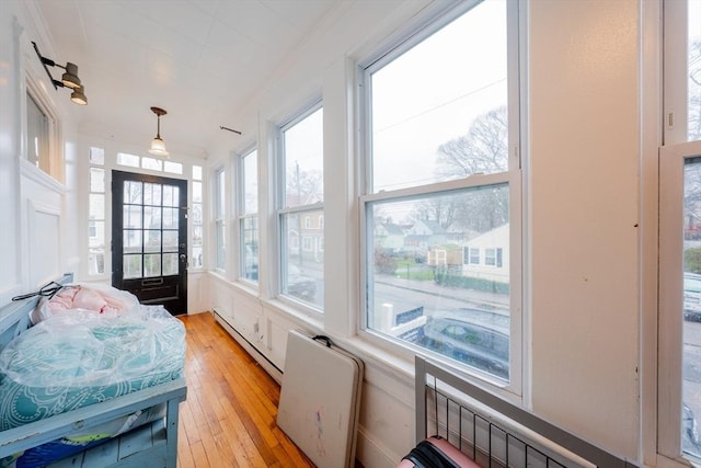 sunroom with a baseboard radiator