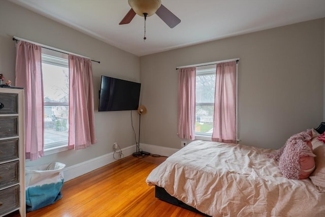 bedroom featuring hardwood / wood-style floors and ceiling fan