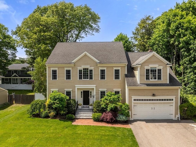 153 Valley Rd, Needham, MA 02492 - colonial inspired home featuring driveway, a garage, and roof with shingles