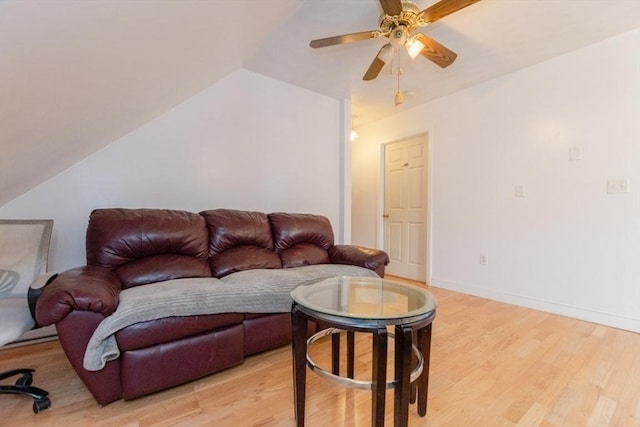 living room featuring lofted ceiling, ceiling fan, and light hardwood / wood-style flooring