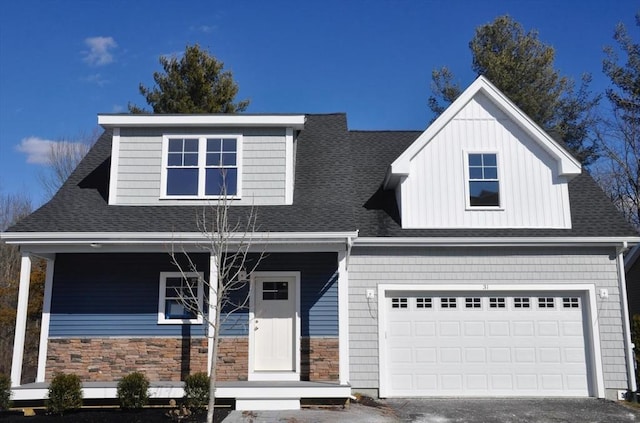 view of front of house featuring a garage, stone siding, roof with shingles, and driveway